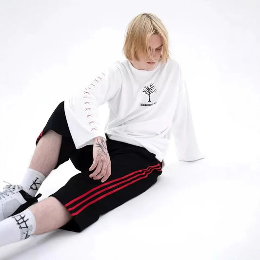 T-shirt à manches longues en pur coton, style streetwear décontracté et tendance, idéal pour le printemps et l'automne. Col rond.