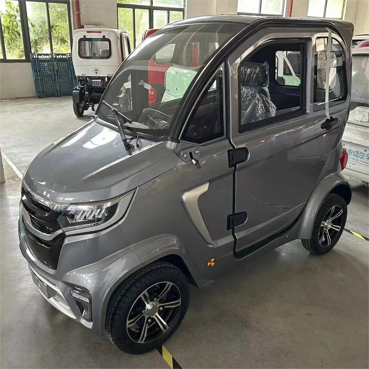 Factory Wholesale 2000W Small New Energy Adult Vehicle Low-Speed Four-Wheel Electric Car Three Seats Urban Commute 45km/h