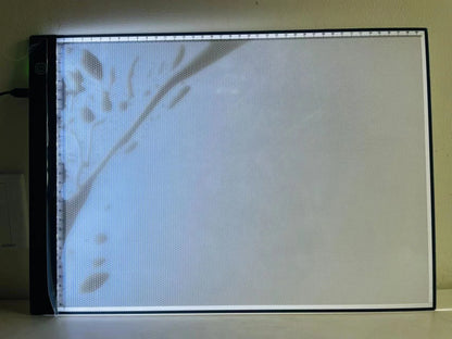 A3 Small Size Light Pad with Graduated Three-stage Adjustable Luminescent Backlight Illuminates the Drawing Board in the Dark.
