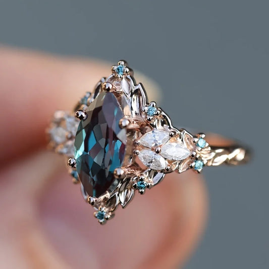 Elegant Marquise Synthetic Crystal Engagement Ring for Women | Copper 6-Prong Set, June Birthstone, Rose-Tone Leaf Design