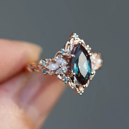 Elegant Marquise Synthetic Crystal Engagement Ring for Women | Copper 6-Prong Set, June Birthstone, Rose-Tone Leaf Design