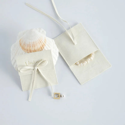 Wholesale 8*8cm Cream Luxury Microfiber Soft Packaging Bag Custom Unique Design with High Quality Logo for Jewelry Container