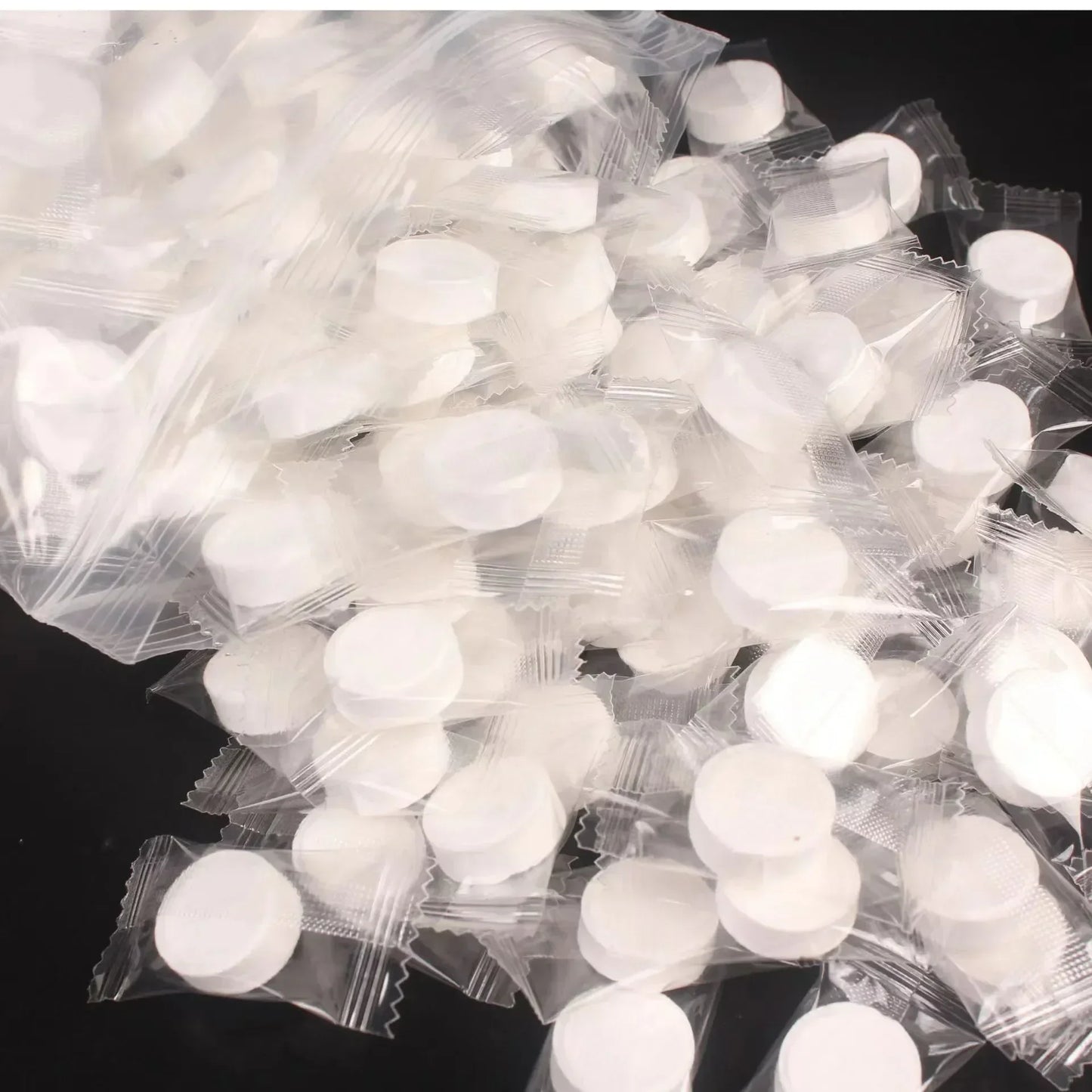 100pcs Disposable Compressed Facial Mask Portable Travel Non-woven Face Mask Skin Care Cotton Wrapped Masks Paper