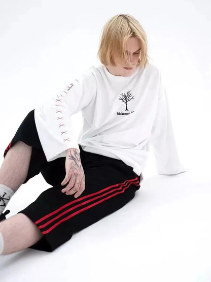 T-shirt à manches longues en pur coton, style streetwear décontracté et tendance, idéal pour le printemps et l'automne. Col rond.