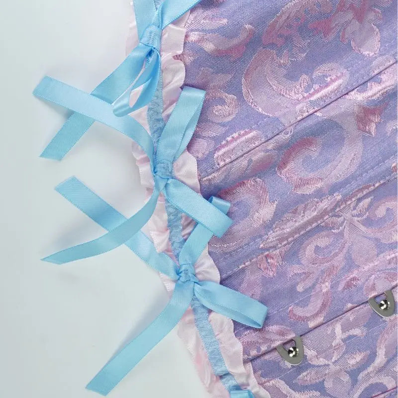 A lake blue dress with a flower patterned corset and a cinched waist for slimming ladies